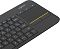 Фото-4 Клавиатура Logitech K400 Plus, крупный план правой части сверху; на фото сенсорная панель, верхние кнопки над ней и часть клавиатурного блока в чёрном корпусе; важно для карточки товара, чтобы показать область управления курсором и расположение дополнительных клавиш.