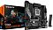 Фото-5 Материнская плата Gigabyte B760M GAMING X WIFI6E GEN5 &mdash; фото с упаковкой: плата рядом с коробкой GAMING X WIFI6E GEN5 и чёрной Wi‑Fi‑антенной; видны сокет LGA1700, четыре слота DDR5 и кожух GAMING для идентификации модели и комплекта.