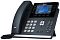 Фото-2 IP-телефон Yealink SIP-T46U, ракурс спереди-сбоку; тёмно-серый корпус, цветной дисплей, боковые клавиши линий с индикаторами, светло-серые кнопки набора, серебристая вставка снизу &mdash; важно для понимания расположения клавиш и угла наклона.