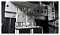 Фото-4 Блок розеток PDU TSMO Rem REM-32 Zero-U R-32-16S-8C19-A-AM-1420-K, фото монтажа: металлический кронштейн с продолговатыми отверстиями и винтами внутри стойки/шкафа; показывает способ крепления PDU в серверной стойке.