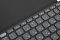 Фото-3 Клавиатура Logitech Keys-To-Go 2, крупный план центральной части; видны функциональные клавиши F4–F10 с пиктограммами яркости, переключения окон, эмодзи и мультимедиа, а также тёмно-серая крышка-обложка за клавиатурой. Подходит для страницы товара, чтобы показать дополнительные функции верхнего ряда.
