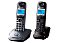 Фото-2 DECT-радиотелефон Panasonic KX-TG2512RU, вид под углом на две трубки на подставках, тёмно-серые корпуса, синие ЖК-экраны и центральные навигационные клавиши