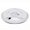 Фото-2 Точка доступа Ubiquiti UniFi nanoHD UAP-NANOHD-5, вид снизу; круглый белый корпус, порт RJ-45 и отверстие Reset, фото важно для оценки подключения и монтажной стороны устройства.