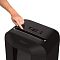 Фото-2 Уничтожитель бумаги Fellowes Powershred LX85, крупный план верхней панели на белом фоне: рука указывает на слот подачи, рядом ползунок режимов и индикаторы; важно, чтобы рассмотреть управление и зону подачи бумаги на странице товара.