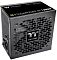 Фото-2 Блок питания для ПК Thermaltake Toughpower GT 1200W, вид спереди и сбоку под углом; показаны крупная перфорированная решётка с логотипом Thermaltake, боковая маркировка 1200W и задняя панель с входом питания; графитовый корпус помогает показать внешний вид и вентиляцию устройства.