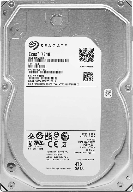 Фото-1 Жёсткий диск Seagate Exos 7E10 ST4000NM000B, вид сверху; белая сервисная этикетка Seagate с надписью Exos 7E10, указанием «4TB SATA» и QR‑кодами, серебристая крышка с винтами; важно для сверки модели и интерфейса.