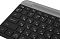 Фото-7 Клавиатура Logitech K580 920-009208, нижняя панель: чёрное основание с длинными резиновыми ножками, сервисной наклейкой и отсеком питания на обратной стороне; изображение на светлом фоне для карточки товара, показывает конструкцию основания и опорные элементы.