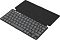 Фото-12 Клавиатура Logitech Keys-To-Go 2, вид спереди слева под углом в открытом состоянии; показаны компактная раскладка, защитная крышка-обложка сзади и тёмно-серые низкопрофильные клавиши. Полезно для страницы товара, чтобы показать конструкцию с откидной крышкой и формат клавиатуры.