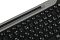 Фото-4 Клавиатура A4Tech Fstyler FBK25 Black, крупный план верхнего ряда: чёрные функциональные клавиши F2–F12 с пиктограммами управления мультимедиа и приложениями, над ними проходит серая планка с углублением; изображение на белом фоне для карточки товара, показывает дополнительные функции верхнего ряда.