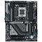 Фото-2 Материнская плата GIGABYTE X870 GAMING X WIFI7 &mdash; вид сверху; видны сокет AM5, 4 слота DDR5, крупный кожух M.2 с линиями и логотипом GIGABYTE, слот PCIe x16 и боковые SATA‑порты; чёрно‑серое оформление с голубовато‑бирюзовыми акцентами на белом фоне, чтобы на странице товара оценить компоновку и зоны охлаждения.