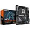 Фото-1 Материнская плата GIGABYTE X870 GAMING X WIFI7 &mdash; плата рядом с коробкой; виден сокет AM5, 4 слота памяти и серо‑чёрные кожухи, на кожухе задней панели светится надпись GAMING; на белом фоне, чтобы на странице товара показать внешний вид и упаковку версии WIFI7.