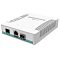 Фото-2 Коммутатор MikroTik CRS106-1C-5S, вид с противоположной стороны под углом; белый корпус, на торце показаны консольный порт, PoE In и комбинированный COMBO-разъём, сверху ряд индикаторов; этот ракурс важен для страницы товара, чтобы показать служебные интерфейсы.