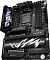 Фото-7 Материнская плата ASUS ROG Crosshair X870E Hero, крупный план верхней части платы под углом: показаны экран, кожух задней панели, сокет процессора и четыре слота памяти; изображение важно для страницы, чтобы рассмотреть верхнюю зону платы и элементы охлаждения.
