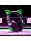 Фото-7 Наушники Razer Kraken Kitty V2 BT, чёрная гарнитура на столе в игровом сетапе; видны подсвеченные ушки и чашка, клавиатура и монитор на фоне, мягкие амбушюры в рабочем положении; изображение показывает сценарий использования модели на странице товара.