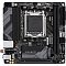 Фото-1 Материнская плата Gigabyte B650I AX, вид сверху: чёрная mini‑ITX плата с сокетом AM5 (заглушка), 2 слота DDR5, один длинный слот PCIe и кожух M.2 с логотипом GIGABYTE; важно для страницы &mdash; показывает компоновку mini‑ITX.