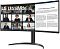 Фото-3 Монитор LG 34WR55QK-B, фронтальный ракурс справа. Чёрный изогнутый экран UltraWide, тонкие рамки, цилиндрическая стойка и широкое дугообразное основание; на дисплее разделены видеоконференция и рабочий документ. Подходит для страницы товара как фото изогнутого экрана под углом.