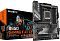 Фото-5 Материнская плата Gigabyte B650 GAMING X AX V2, фото с упаковкой: плата ATX рядом с коробкой B650 GAMING X AX V2; видны кожух VRM GAMING и 4 слота DDR5, чтобы показать товар и коробку на странице.