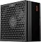 Фото-7 Блок питания PCCooler P5 YN1000 G1F, вид сбоку на корпус; на фото чёрная боковая панель с оранжевым логотипом, узкая перфорированная вставка и треугольная решётка вентилятора на соседней плоскости, изображение показывает отделку корпуса для страницы товара.