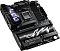Фото-4 Материнская плата ASUS ROG Crosshair X870E Hero, низкий ракурс спереди: акцент на радиаторах M.2, декоративном кожухе и верхней панели с экраном, видны слоты памяти и сокет; фото важно для страницы, чтобы показать конструктивные элементы и оформление платы.