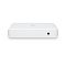 Фото-5 Коммутатор Ubiquiti USW Lite 8 PoE, задний ракурс сверху: белый корпус со скруглённой крышкой, справа круглый вход питания 54VDC, передняя панель скрыта; фото важно для обзора тыльной стороны корпуса.