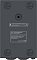 Фото-3 Стабилизатор напряжения Powercom PCM AVR WM‑2000VA, вид снизу/сзади: маркировочная наклейка с моделью и параметрами, резиновые опоры, на белом фоне; важно для проверки маркировки.