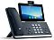 Фото-3 IP-телефон Yealink SIP-T58W Pro with camera, ракурс спереди-слева под углом; чёрный корпус, камера на верхней кромке экрана, трубка слева, цифровая клавиатура по центру — помогает оценить профиль устройства и расположение камеры относительно экрана.