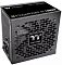 Фото-2 Блок питания Thermaltake Toughpower GT 1000W 1000 Вт, фронтальный вид сзади и сверху под углом. Видны перфорированная задняя панель, сетевой вход, выключатель питания и крупная верхняя решётка вентилятора с центральным логотипом. Фото на светлом фоне важно для страницы товара, потому что показывает вентиляцию и сетевое подключение блока питания.