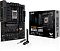 Фото-11 Материнская плата ASUS TUF GAMING B650‑E WIFI, фото с упаковкой и антенной: плата рядом с коробкой B650‑E WIFI и Wi‑Fi антенной; чёрная плата с радиаторами и 4 слотами DDR5 видна спереди, чтобы показать комплект поставки на странице товара.