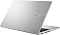 Фото-5 Ноутбук ASUS Vivobook 15 M1502NAQ-BQ272, вид сзади слева на крышку; показаны серебристая верхняя панель, рельефный логотип ASUS Vivobook и вентиляционные прорези сбоку, изображение помогает оценить оформление корпуса.