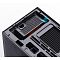 Фото-20 Корпус Jonsbo D32 Pro Black, крупный план верхней части: посадочное место блока питания с перфорацией и разъёмом IEC, рядом металлические монтажные прорези и синяя защёлка/фиксатор &mdash; чтобы оценить крепления и доступ к зоне БП сверху.