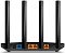 Фото-2 Wi‑Fi роутер TP-Link Archer AX12, вид сзади на разъёмы: гнездо питания, порт WAN (синий), три порта LAN (оранжевые), кнопка WPS/Reset; изображение важно для понимания схемы проводного подключения.