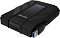 Фото-3 Внешний жёсткий диск ADATA HD710 Pro AHD710P-2TU31-CBK — крупный план торца; рядом показан штекер USB-A с синим вкладышем, на корпусе резиновая заглушка порта с маркировкой USB, видны рельефные накладки и центральная вставка с карбоновой текстурой; фото важно для понимания подключения и защиты разъёма.