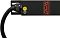 Фото-4 Распределитель питания Powercom PDU 32A Type 5: крупный план торца, ввод кабеля через гермоввод, винт/значок заземления и крепёжное ухо, логотип на чёрном корпусе — показывает место подключения кабеля и элементы монтажа в стойку.