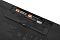 Фото-13 Мембранная клавиатура Logitech Signature K650, открытый батарейный отсек снизу; внутри установлены две батарейки AA, видна крышка отсека и маркировка рядом с контактами, чёрный корпус; изображение показывает питание клавиатуры на странице товара.