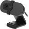 Фото-1 Веб-камера Logitech Brio 90, вид спереди слева на настольной клипсе. Видны объектив, механическая шторка приватности с логотипом logi и складное крепление, цвет чёрный. Фото показывает внешний вид корпуса и конструкцию крепления для страницы товара веб-камеры.