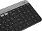 Фото-5 Клавиатура Logitech K580 920-009208, правый профиль: чёрный корпус, низкопрофильные клавиши и серебристая верхняя планка с пазом-подставкой по всей ширине; изображение на светлом фоне для карточки товара, показывает форму корпуса по правому торцу.
