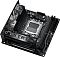 Фото-5 Материнская плата ASUS ROG STRIX X870-I GAMING WIFI mini-ITX AM5, вид спереди под углом без боковой платы-адаптера. Видны сокет, два слота памяти, радиаторы и открытые боковые разъёмы на кромке, цвет чёрный и графитовый. Это важно для страницы товара, чтобы показать базовую компоновку платы без подключённых модулей.