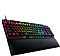 Фото-2 Клавиатура Razer Huntsman V2, вид под углом слева с подставкой для запястий; видны высокий профиль клавиш, чёрный корпус, RGB-подсветка и широкая опора для кистей с логотипом Razer. Для страницы товара важно, потому что изображение показывает посадку клавиш и форму комплекта в перспективе.