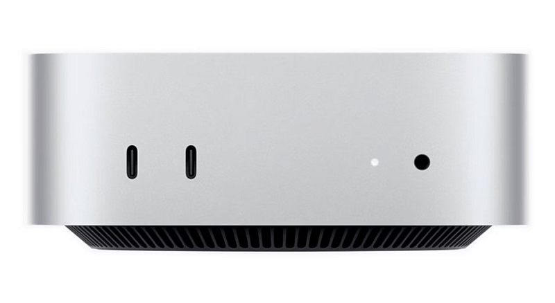 Фото-1 Мини‑ПК Apple Mac mini MU9E3 — передняя сторона корпуса крупным планом; два порта USB‑C слева, световой индикатор и круглый разъём 3,5 мм справа, снизу круговая решётка вентиляции; серебристый алюминиевый корпус; важно для страницы товара, чтобы увидеть передние порты и индикатор.