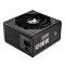 Фото-4 Блок питания для ПК ASUS TUF Gaming 1200W, вид под углом; чёрный корпус с верхней решёткой вентилятора и логотипом TUF, на боковой панели крупная маркировка "TUF GAMING 1200W", на торце видны разъём питания IEC и тумблер включения, фото важно для проверки внешнего вида и расположения элементов подключения.