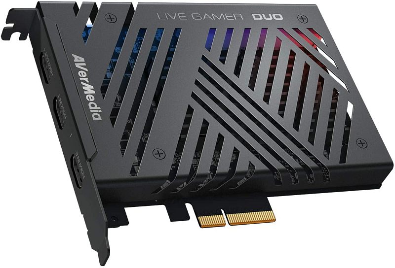 Фото-1 Карта видеозахвата AVerMedia Live Gamer Duo GC570D, вид спереди под углом на белом фоне; видны чёрный металлический кожух с прорезями, надписи AVerMedia и LIVE GAMER DUO, разъём PCIe и два HDMI на монтажной планке; фото показывает интерфейсы и конструкцию платы захвата для страницы товара.