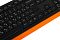 Фото-18 Клавиатура A4Tech F1010 (Orange), крупный план центральной зоны: клавиши со знаками русской раскладки, блок стрелок и служебные кнопки, оранжевая нижняя часть корпуса по краю; важно для понимания раскладки и компоновки.