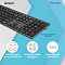 Фото-18 Клавиатура A4Tech FBX50C Grey, крупный план нижней стороны по центру; видна заводская наклейка с маркировкой модели, круглая ножка и матовая фактура чёрного основания. Изображение для страницы товара показывает служебную маркировку на корпусе.
