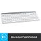 Фото-3 Клавиатура Logitech K580 920-009209, вид сверху справа под углом: белый корпус, серые клавиши цифрового блока, серая верхняя планка с пазом-подставкой и логотип logi; изображение на светлом фоне для карточки товара, показывает правую часть раскладки и встроенную подставку для мобильного устройства.
