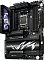 Фото-3 Материнская плата ASUS ROG Crosshair X870E Hero, вертикальный ракурс под углом: видны сокет AM5, четыре слота памяти, высокий кожух с экраном и массивные радиаторы накопителей; изображение помогает оценить высоту элементов и компоновку верхней части платы.