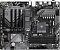 Фото-1 Материнская плата Gigabyte B550 EAGLE WIFI6, вид сверху; чёрная PCB с серой графикой, сокет AM4 и четыре слота DDR4, радиаторы VRM с надписью RISE TO THE TOP и радиатор чипсета GIGABYTE, по краю видна маркировка WIFI6; фото показывает компоновку и ключевые узлы платы.