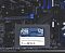 Фото-5 SSD Patriot P210 2.5 128GB, демонстрация накопителя на фоне материнской платы. На фото диск расположен перед платой с синими слотами и разъёмами, видна лицевая наклейка P210 128GB. Изображение полезно для страницы товара, потому что показывает устройство в сборке ПК.
